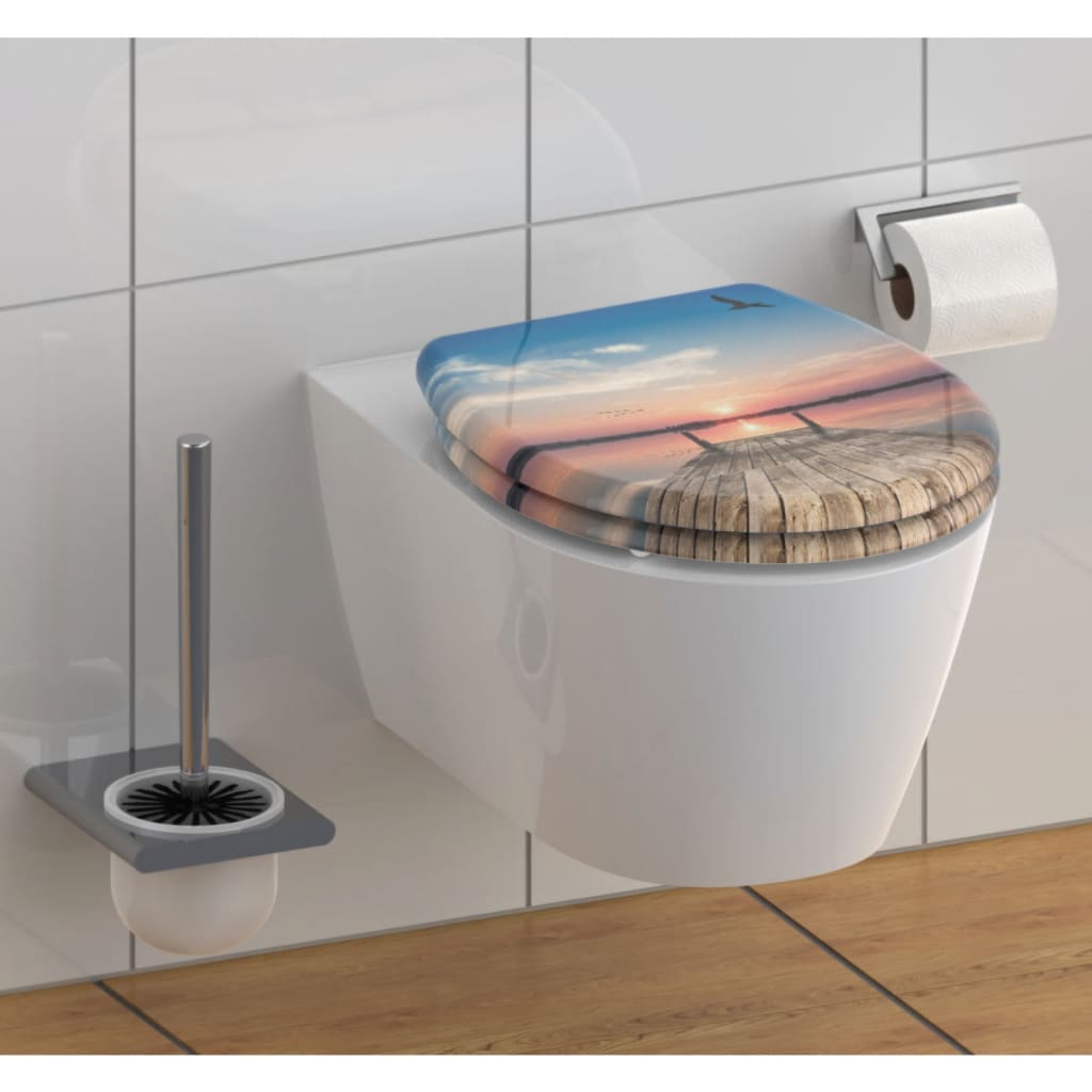 Asiento de inodoro Schütte con cielo de puesta de sol de liberación rápida de cierre suave
